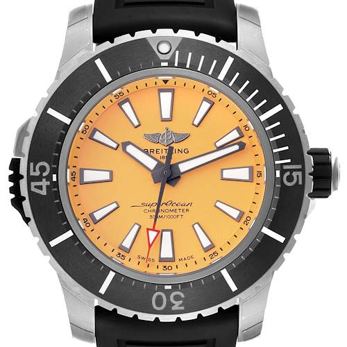 The image shows a front view of a Breitling Superocean watch, highlighting its orange dial, bezel, hands, and strap.