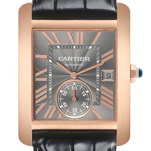 The Tank MC by Cartier is shown from a front angle, highlighting its rectangular face, Roman numerals, and date display.