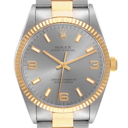 The image shows a frontal view of a Rolex Oyster Perpetual watch, highlighting the face, bezel, and part of the bracelet.