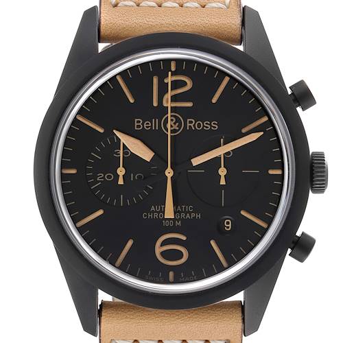 The image shows a front view of the Bell & Ross Heritage model watch, displaying its dial, hands, and beige leather strap.