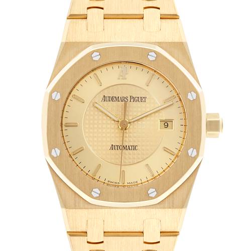 The image shows a front view of the Audemars Piguet Royal Oak watch, displaying its gold dial, octagonal bezel, and bracelet.