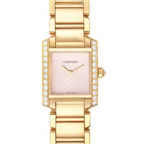 The image shows a front view of a Cartier Tank Francaise watch, highlighting its gold case, diamond-accented bezel, and bracelet.