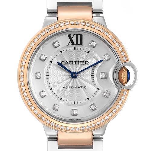 This image shows a close-up of the face and bezel of the Cartier Ballon Bleu watch, displaying its silver dial, diamond hour markers, and blue hands.