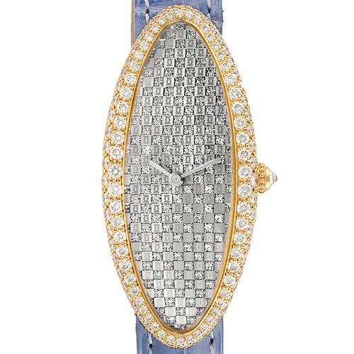 The Cartier Baignoire watch is shown from a front angle, highlighting its elongated oval face adorned with diamonds.