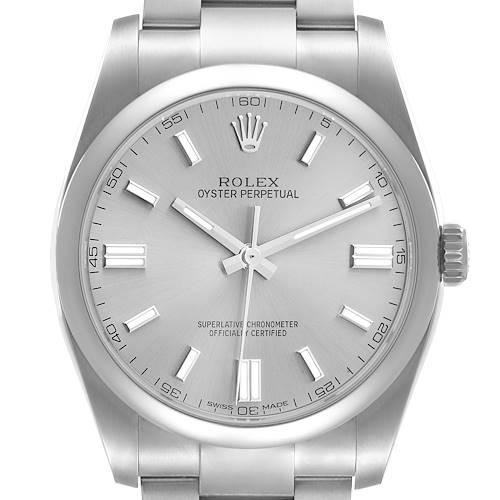 The image shows a Rolex Oyster Perpetual watch from a front angle, highlighting the face, bezel, crown, and a portion of the bracelet.