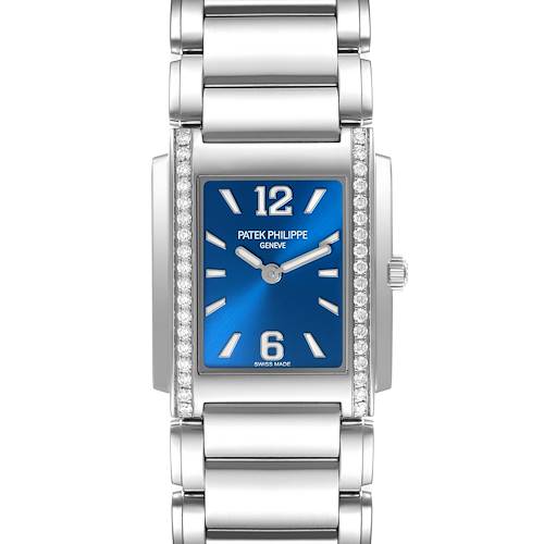 The Patek Philippe Twenty-4 watch is shown from a front view, highlighting the blue dial, diamond-set case, and stainless steel bracelet.
