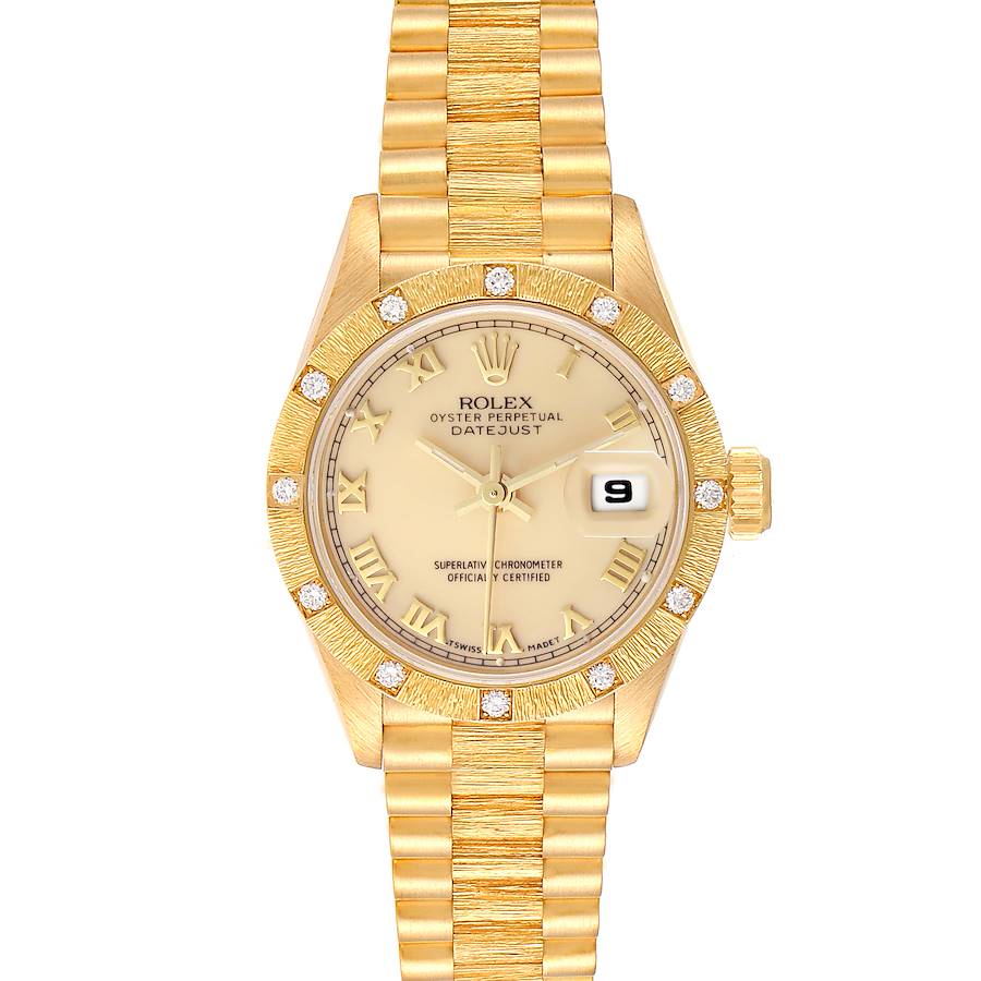 This image shows a frontal view of the Rolex President Oyster Perpetual Datejust with a golden bracelet and diamond-set bezel.