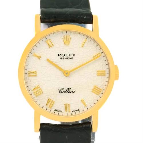 This image shows a frontal view of a Rolex Cellini watch with a gold case, white dial, and black leather strap.