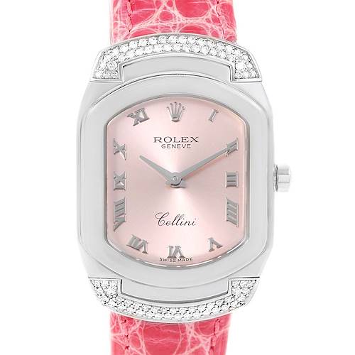 The image shows a front view of the Rolex Cellini watch, displaying its pink dial, Roman numerals, and red strap.