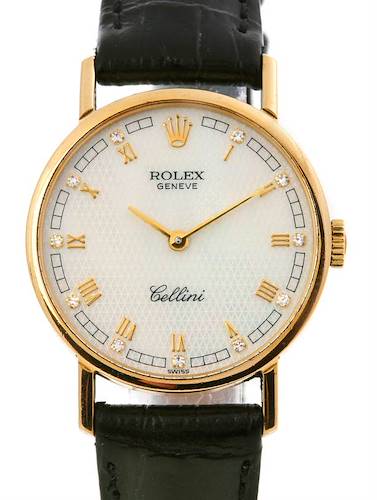 This image shows a front view of a Rolex Cellini watch, highlighting its face, bezel, and part of the black strap.