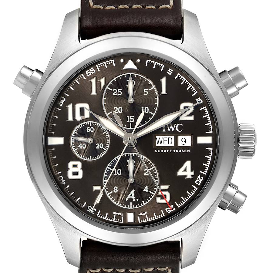 The watch is an IWC Pilot Model showing the face, crown, chronograph buttons, and a leather strap, viewed from the front.