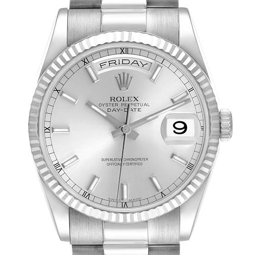 The Rolex President model is shown from a frontal angle, highlighting the face, bezel, and part of the bracelet.