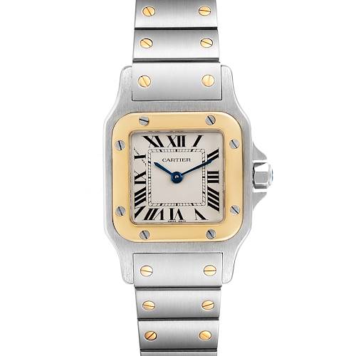 The image shows a front view of a Cartier Santos watch, displaying its face, bezel, and partially visible metal bracelet.