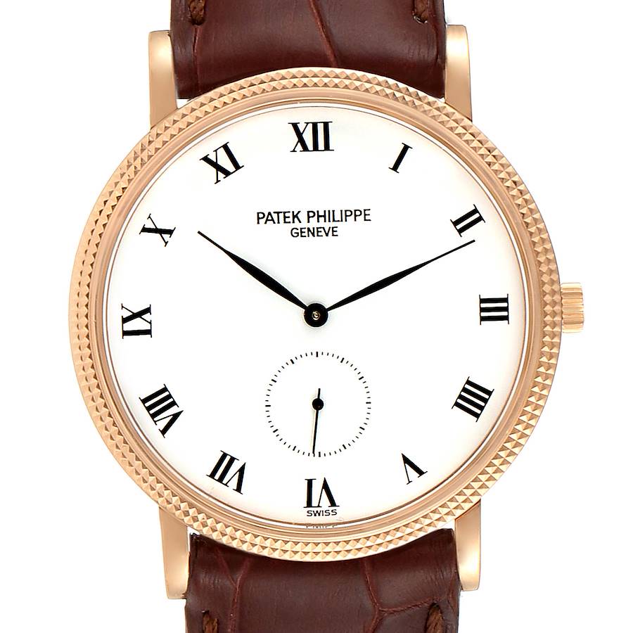 The image shows a close-up, front view of the Patek Philippe Calatrava watch, highlighting its dial, hour markers, hands, and part of the leather strap.