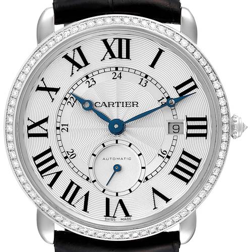 The image shows a front view of the Cartier Ronde watch, highlighting its Roman numeral dial, date window, and diamond bezel.