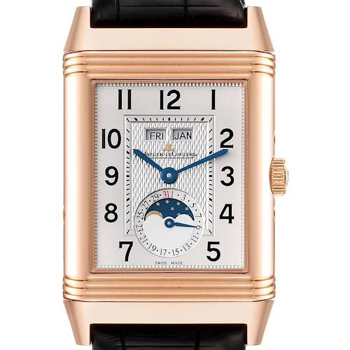 The image shows a front view of the Reverso watch by Jaeger LeCoultre, featuring the dial, hands, date, and moon phase indicators.