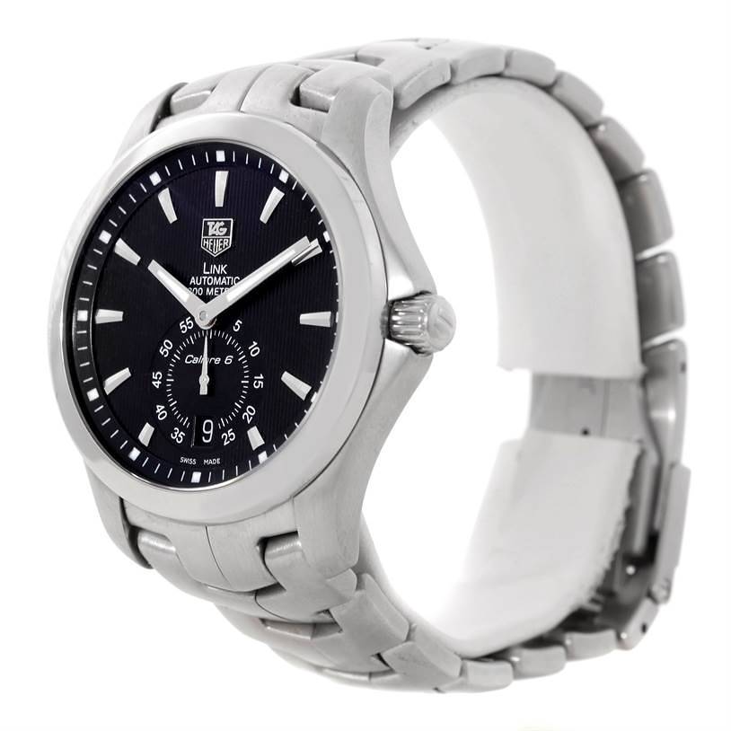 This image showcases a Tag Heuer Link model watch, viewed from a front angled perspective, highlighting the dial, bezel, and chain link bracelet.