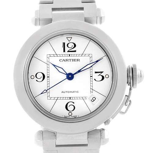 The image shows a close-up frontal view of the Cartier Pasha watch, highlighting its dial, hands, numerals, and crown.