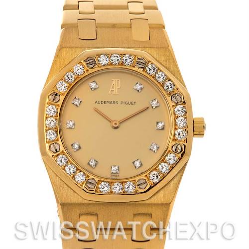 This image shows a front view of a gold Audemars Piguet Royal Oak watch with a diamond-studded bezel and bracelet.