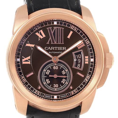 This image shows a front view of the Calibre de Cartier watch by Cartier, displaying the dial, case, and part of the strap.