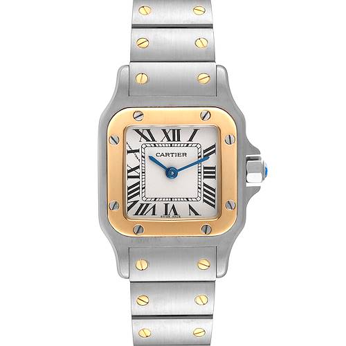 The image shows a front view of a Cartier Santos watch, featuring a rectangular case, Roman numerals, and a metal bracelet.