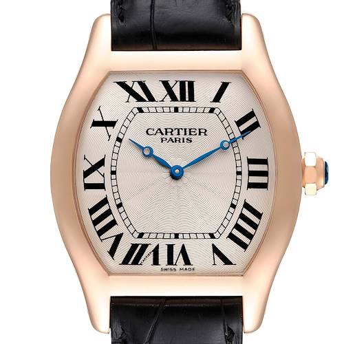 The image shows a frontal view of the Cartier Tortue model watch, displaying its face, Roman numerals, and black leather strap.