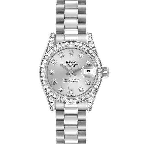 The Rolex President model watch is shown from a top-down angle, highlighting its dial, bezel, bracelet, and date feature.