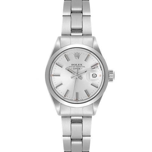 The Rolex Date watch is shown from a front angle, featuring its silver dial, bracelet, and date window.