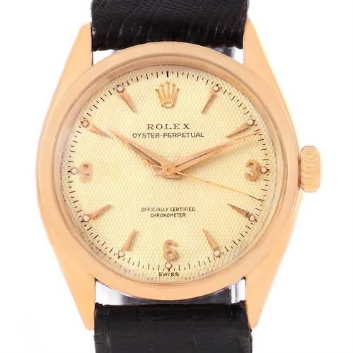 This is a front view of the Rolex Oyster Perpetual Vintage Collection model, showing the dial, hands, crown, and part of the leather strap.