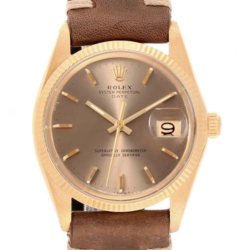 The image shows a front view of the Rolex Vintage Collection model with its brown dial, gold markers, date window, and brown leather strap.
