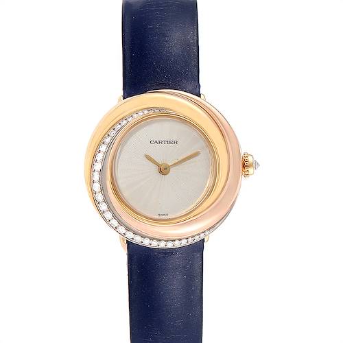 The image displays a Cartier Trinity model watch from a front angle, highlighting its dial, bezel, and blue strap.