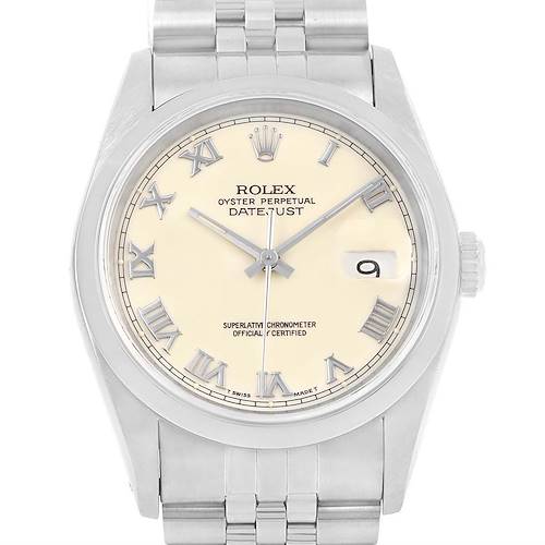The image shows a front view of a Rolex Datejust watch, featuring its cream dial, Roman numerals, date window, and stainless steel bracelet.