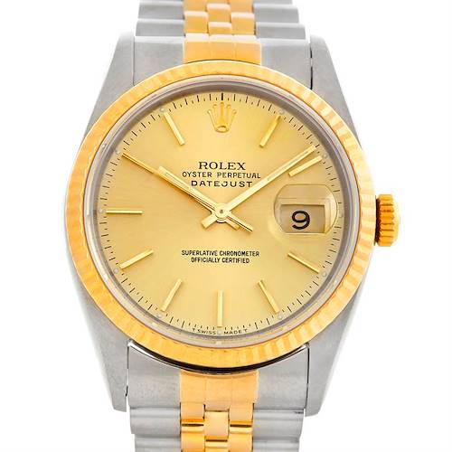 This image shows a frontal view of a Rolex Datejust watch, highlighting its gold dial, date window, and two-tone bracelet.