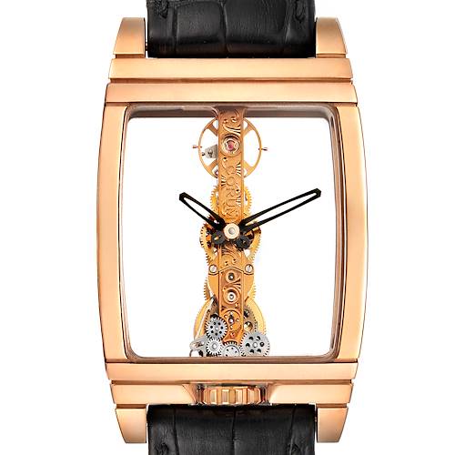 The image shows a Corum Golden Bridge watch front-facing, highlighting its intricate movement and rectangular gold case.