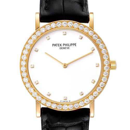 The image shows a front view of a Patek Philippe Calatrava watch with a black strap and diamond-encrusted bezel.