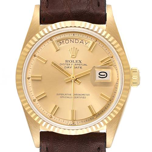 The image shows a frontal view of the Rolex Vintage Collection watch, highlighting its gold dial, day-date display, and brown leather strap.