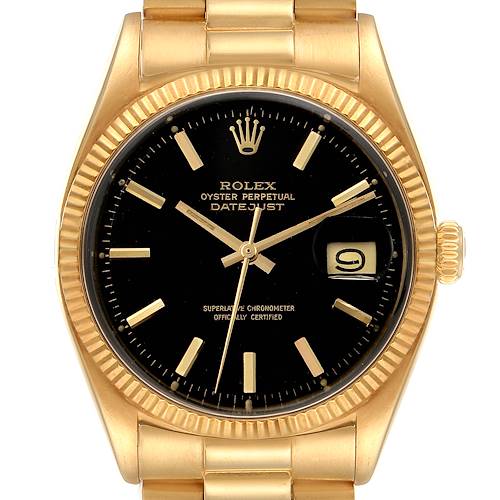 The image shows a front angle of the Rolex Vintage Collection Datejust watch, highlighting its black dial and gold case.