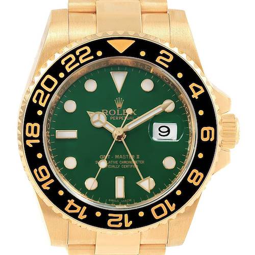 The image shows a front view of the Rolex GMT-Master II watch in gold with a green dial and a black and gold bezel.