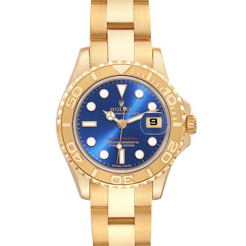 The image shows a Rolex Yacht-Master watch from a straight-on angle, highlighting the blue dial, gold bezel, and bracelet.