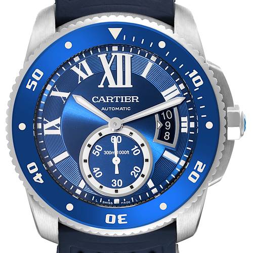 The image shows the full face of the Calibre de Cartier watch, highlighting the blue dial, hands, bezel, and crown.