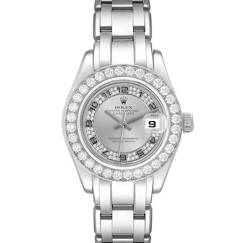 The Rolex Pearlmaster watch is shown from a top-down angle, highlighting its diamond-encrusted bezel and silver bracelet.