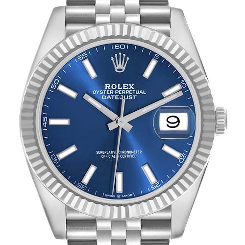 The Rolex Datejust 41 is shown from the front, featuring its blue dial, fluted bezel, date window, and part of the bracelet.
