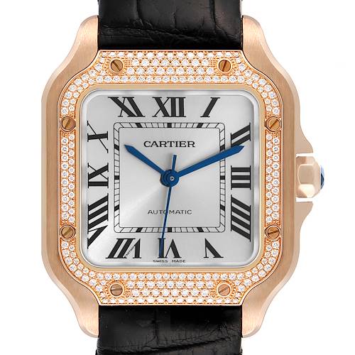 The image shows a front view of a Cartier Santos wristwatch, highlighting its diamond-encrusted bezel and Roman numeral dial.