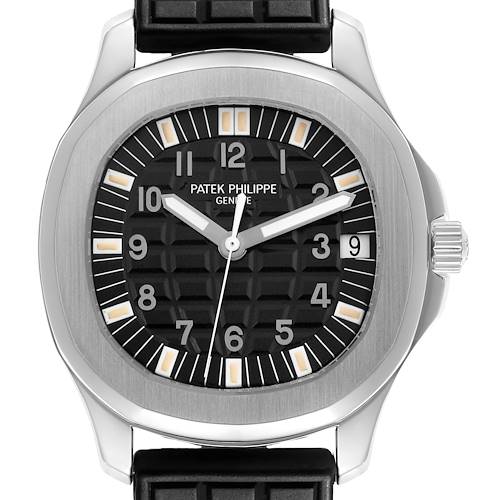 The Patek Philippe Aquanaut watch is shown from a front angle, highlighting the face, hands, bezel, and part of the strap.