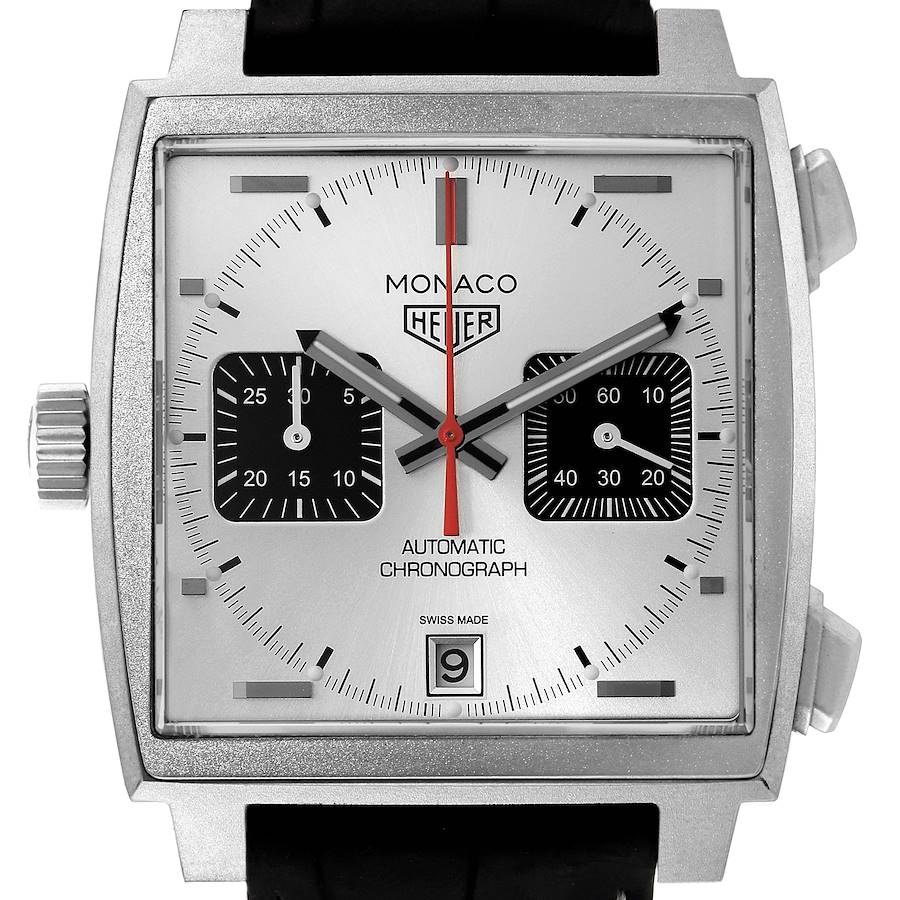The image shows a close-up front view of a Tag Heuer Monaco watch, displaying its square dial, date window, subdials, and crown.