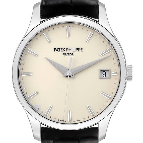 The image shows a frontal view of a Patek Philippe Calatrava watch face with a cream dial and black strap.