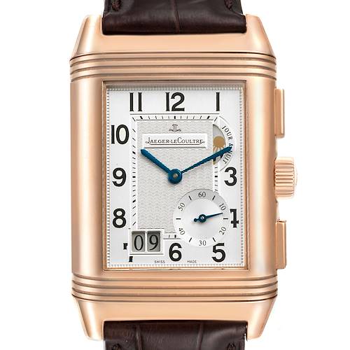 The image shows a frontal view of the Reverso model by Jaeger LeCoultre, highlighting the dial, crown, and part of the strap.