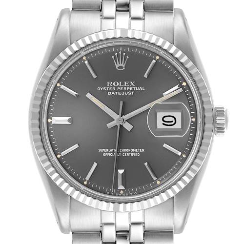 The Rolex Datejust watch is shown from a front angle highlighting the dial, bezel, crown, and part of the bracelet.
