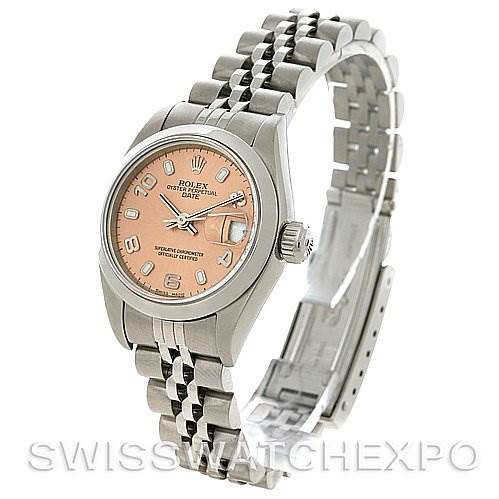 This image shows a Rolex Date model watch at a slight side angle, displaying the dial, bezel, and partially opened bracelet.