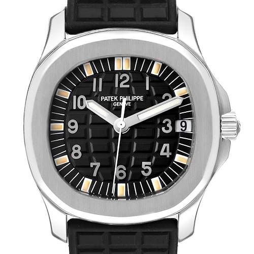 The image shows a front view of a Patek Philippe Aquanaut, highlighting the black dial, hands, and bezel.